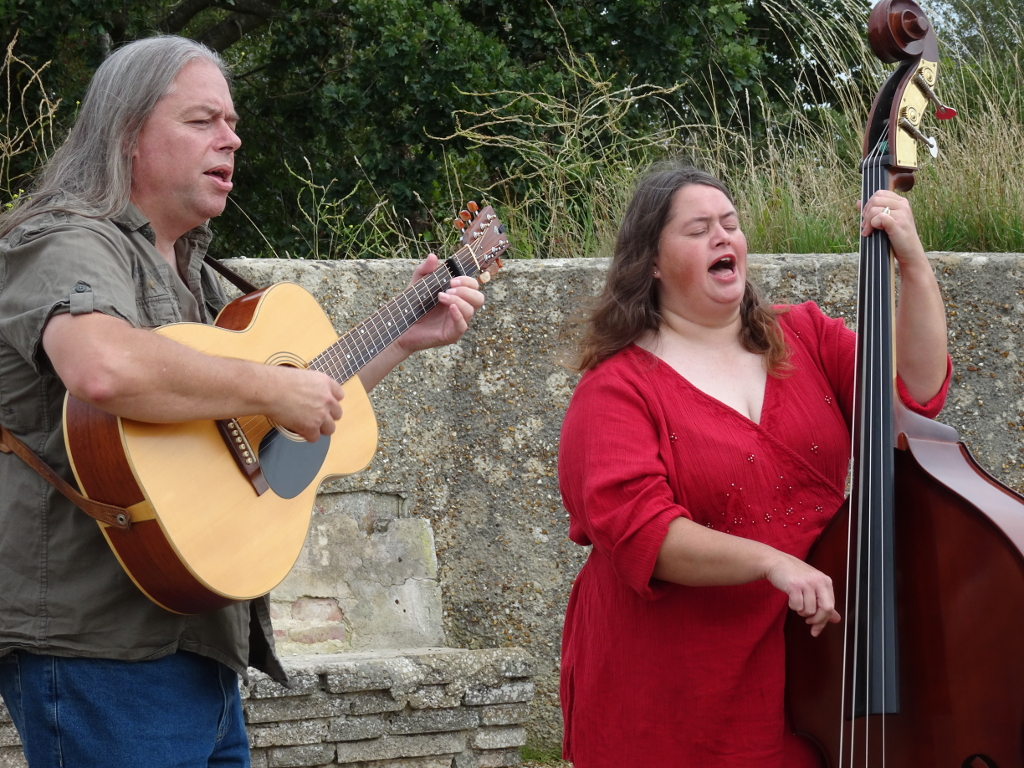 Photograph of Wood, Wire and Words, Pat Francis with mandolin, David Rozzell holding OOO-18 acoustic guitar, Clare Rozzell leaning on her double bass.
